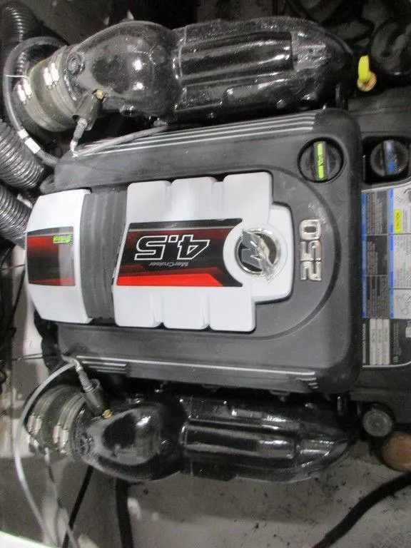 Slide: The Image of Engine of 2023 Hurricane SunDeck 187 IO boat, featuring a 4.5L 250 horsepower motor. - 17
