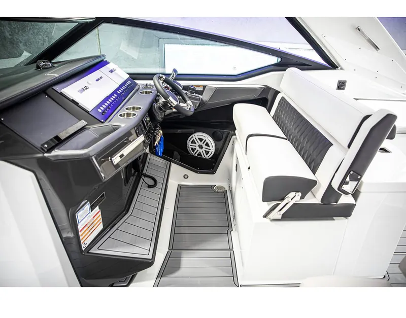 Slide: The Image of 2022 Monterey 38 Super Sport boat interior with modern dashboard and seating. - 10