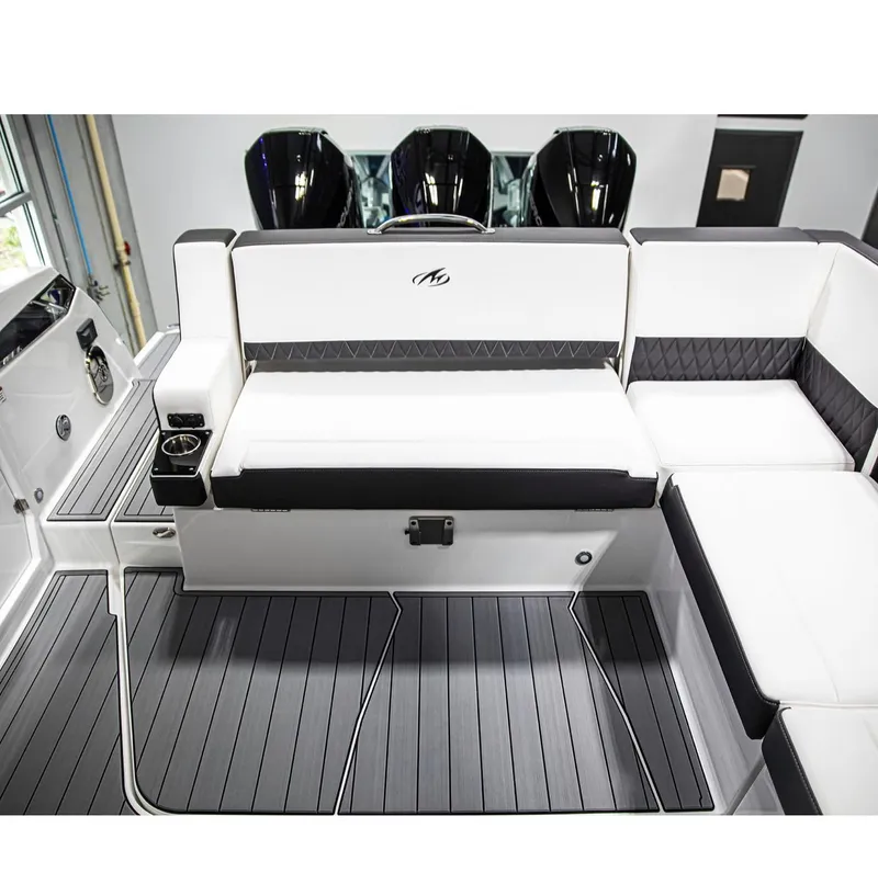 Slide: The Image of 2022 Monterey 38 Super Sport boat interior with white and black seating. - 4