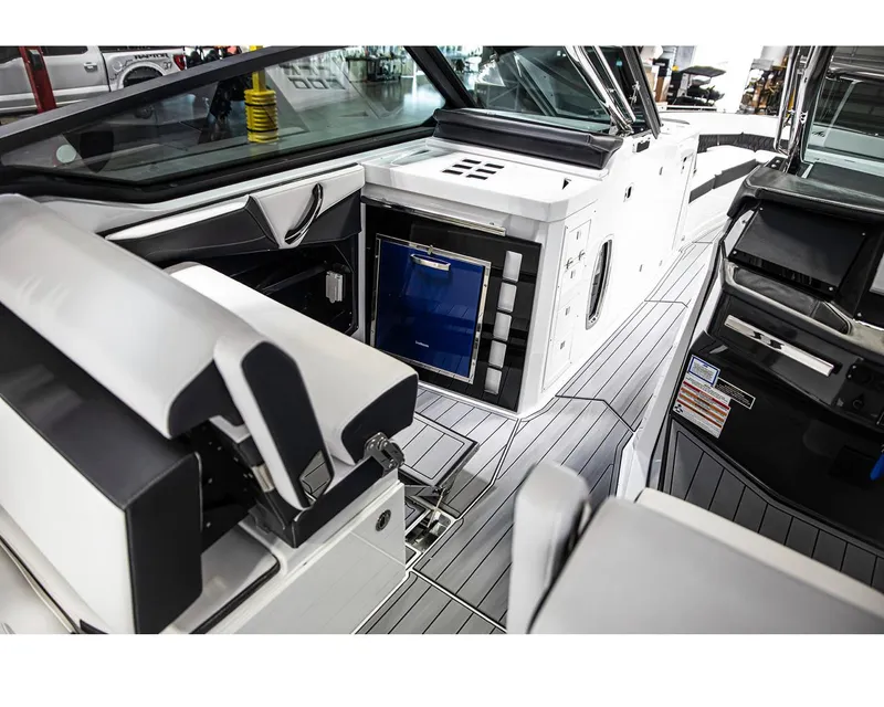 Slide: The Image of Interior of 2022 Monterey 38 Super Sport boat with modern seating and storage. - 5