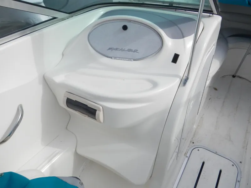 Slide: The Image of 2000 Wellcraft EXCALIBUR boat interior, white console with storage compartment. - 14