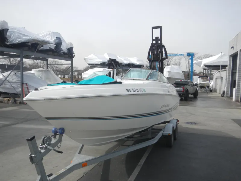 Slide: The Image of 2000 Wellcraft EXCALIBUR boat on trailer in marina storage area. - 3