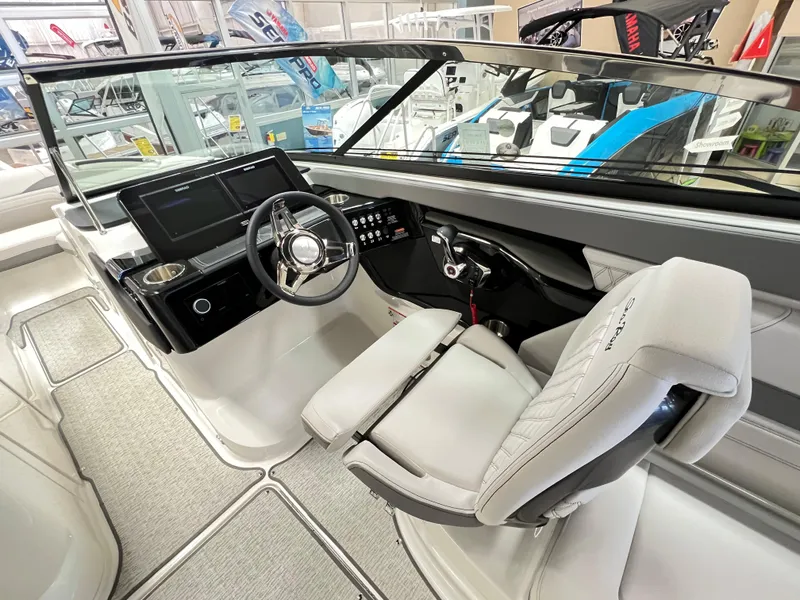 Slide: The Image of 2023 Sea Ray SLX 260 boat interior with modern helm and seating. - 4