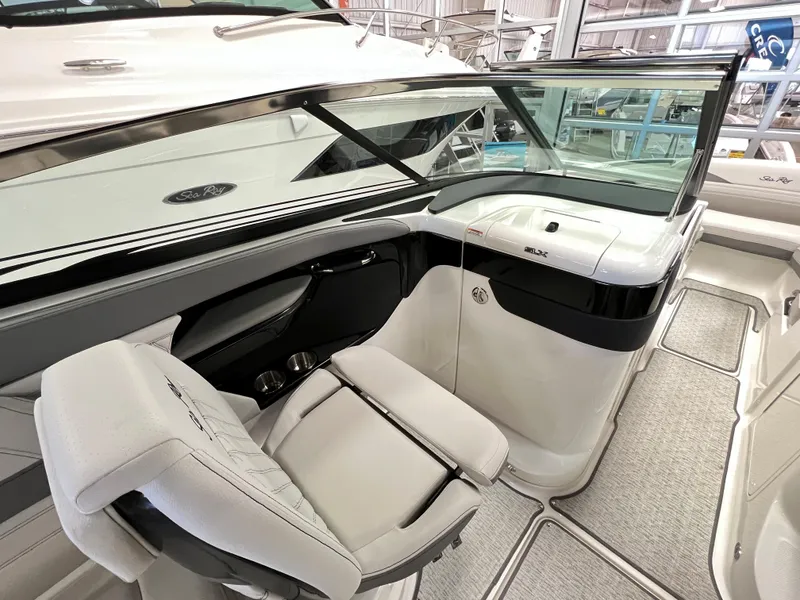 Slide: The Image of 2023 Sea Ray SLX 260 boat interior with helm seat and dashboard. - 5