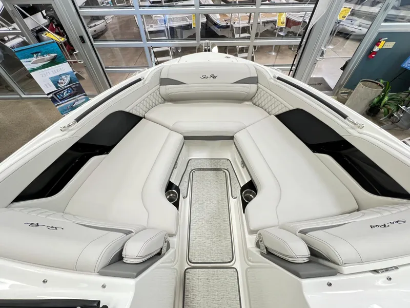 Slide: The Image of 2023 Sea Ray SLX 260 boat interior with luxurious white seating. - 7