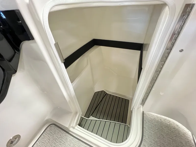 Slide: The Image of 2023 Sea Ray SLX 260 boat interior storage compartment. - 9