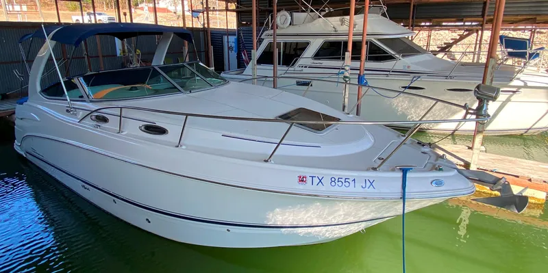 Slide: The Image of 2003 Chaparral 280 Signature boat docked in marina, side view. - 1