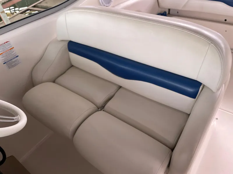 Slide: The Image of 2003 Chaparral 280 Signature boat interior seating, white and blue upholstery. - 10