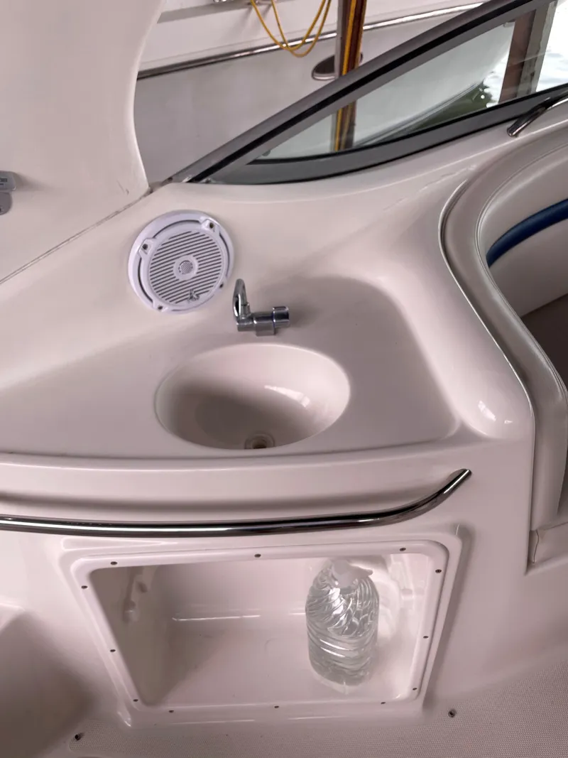 Slide: The Image of 2003 Chaparral 280 Signature boat interior with sink and speaker. - 12