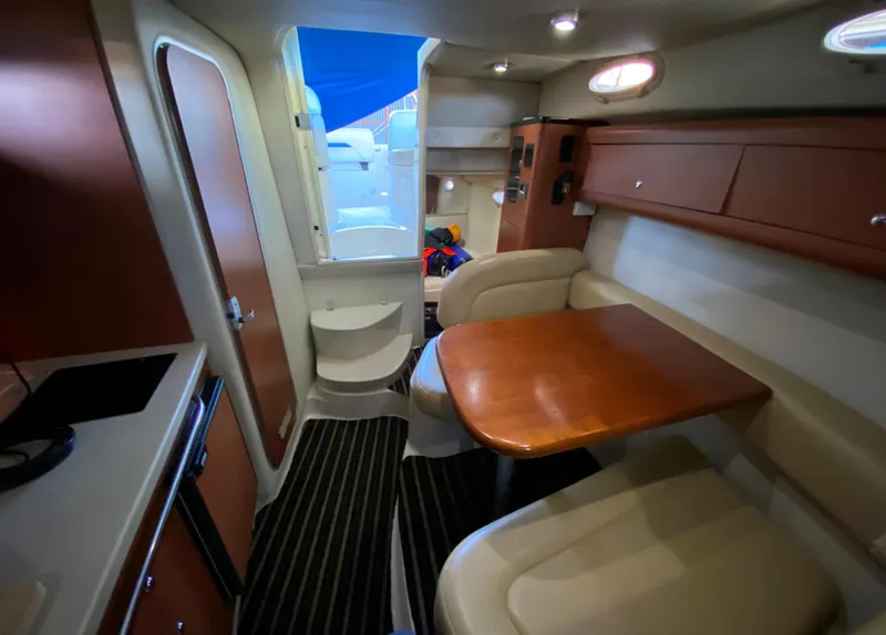 Slide: The Image of Interior of 2003 Chaparral 280 Signature boat with dining area and seating. - 15