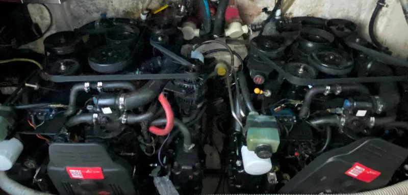 Slide: The Image of Twin engines of a 2003 Chaparral 280 Signature boat in the engine compartment. - 20