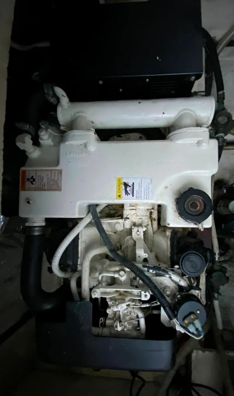 Slide: The Image of Engine of 2003 Chaparral 280 Signature boat, showing mechanical components and hoses. - 21