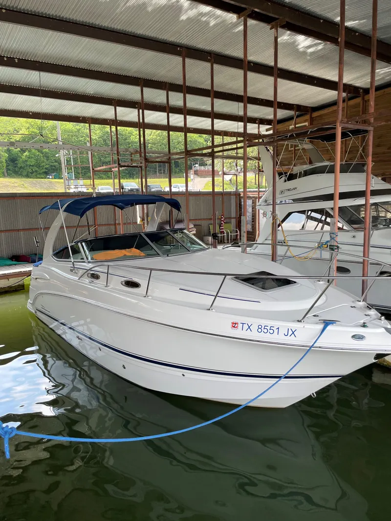Slide: The Image of 2003 Chaparral 280 Signature boat docked in covered marina. - 3