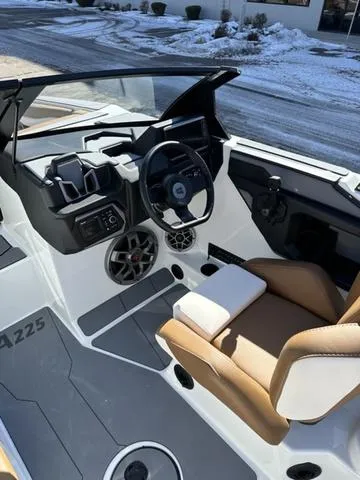 Slide: The Image of 2023 Axis Wake Research A225 boat interior with modern dashboard and seating. - 3