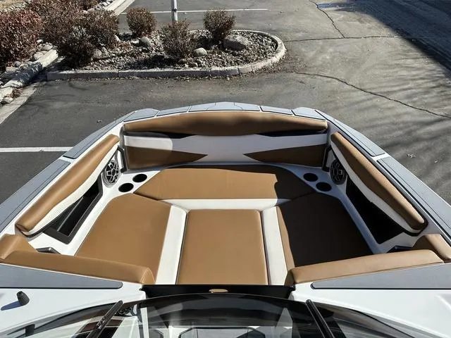 Slide: The Image of 2023 Axis Wake Research A225 boat interior with tan and white seating. - 4