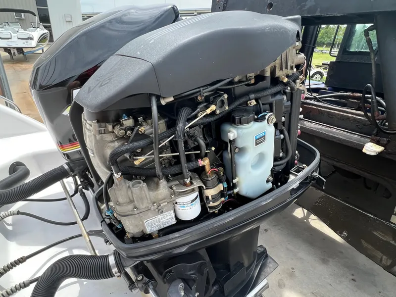 Slide: The Image of 2002 Donzi 29 ZF Cuddy outboard engine, detailed view of components and wiring. - 10