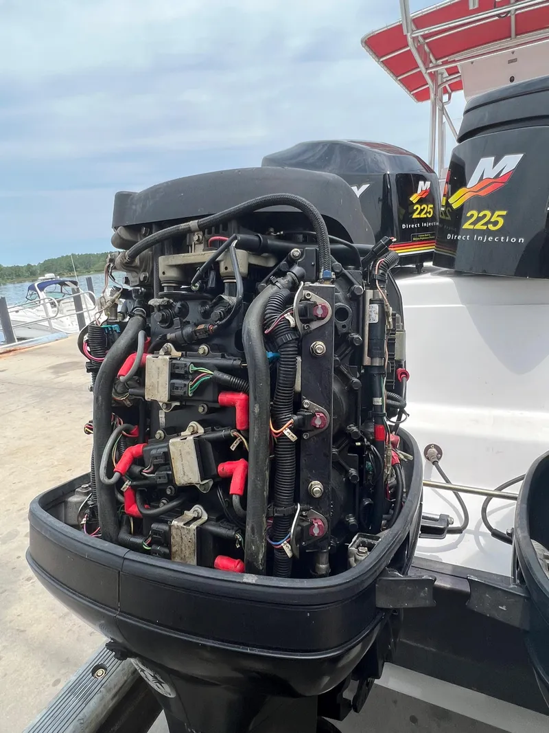 Slide: The Image of Close-up of a 2002 Donzi 29 ZF Cuddy boat engine at a dock. - 14