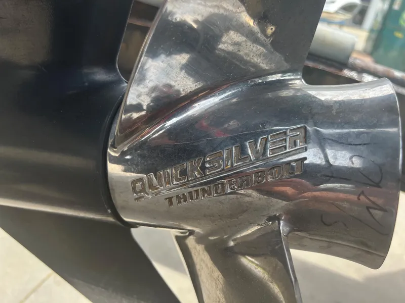 Slide: The Image of Close-up of Quicksilver Thunderbolt propeller on 2002 Donzi 29 ZF Cuddy boat. - 21