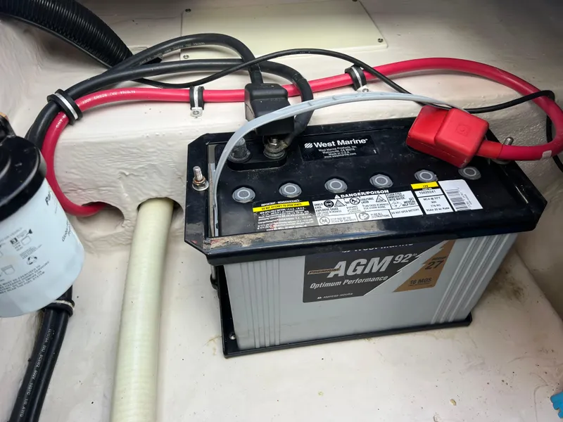 Slide: The Image of Battery compartment of a 2002 Donzi 29 ZF Cuddy boat with AGM battery. - 30