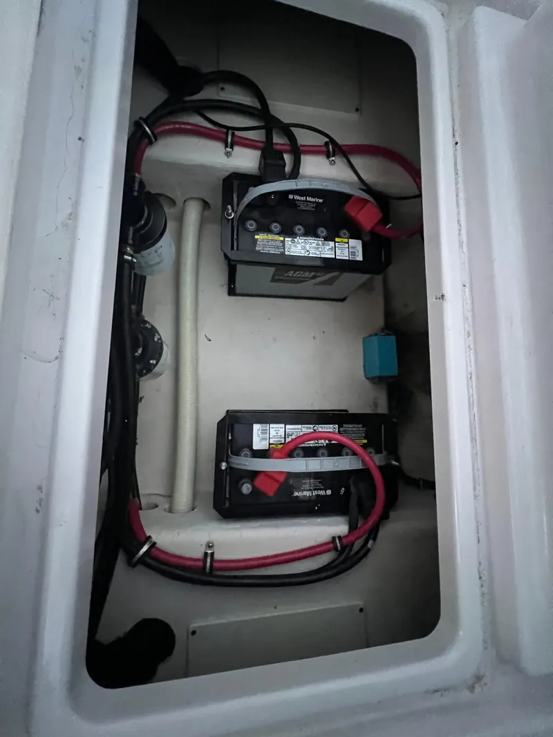 Slide: The Image of 2002 Donzi 29 ZF Cuddy boat battery compartment with wiring. - 32