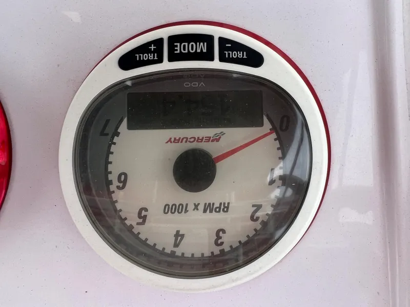 Slide: The Image of Mercury tachometer on 2002 Donzi 29 ZF Cuddy boat dashboard. - 35