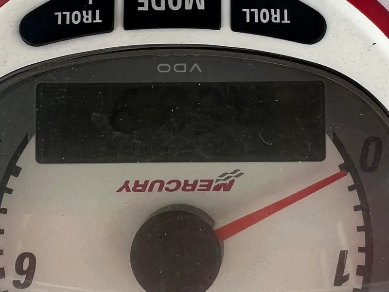 Slide: The Image of Mercury speedometer on 2002 Donzi 29 ZF Cuddy boat dashboard. - 37