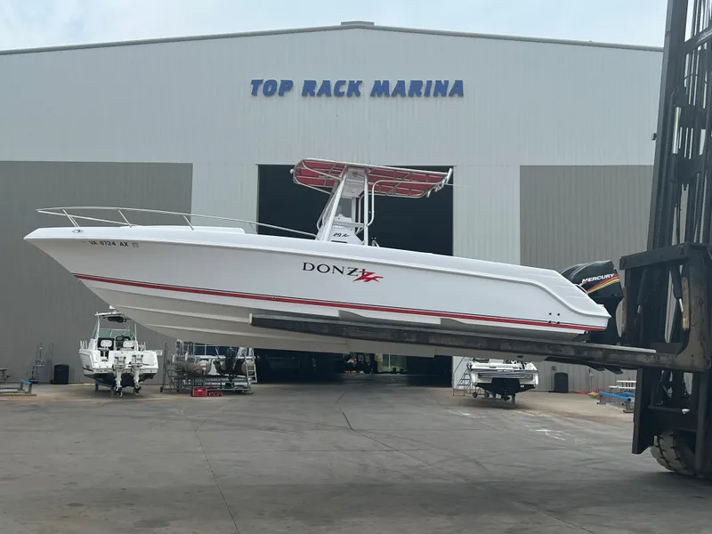Slide: The Image of 2002 Donzi 29 ZF Cuddy boat at Top Rack Marina. - 4