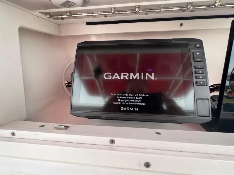 Slide: The Image of Garmin navigation system on 2002 Donzi 29 ZF Cuddy boat dashboard. - 40