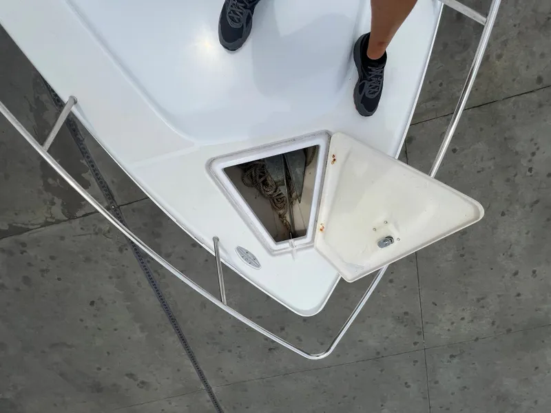 Slide: The Image of 2002 Donzi 29 ZF Cuddy boat deck with open anchor hatch. - 41