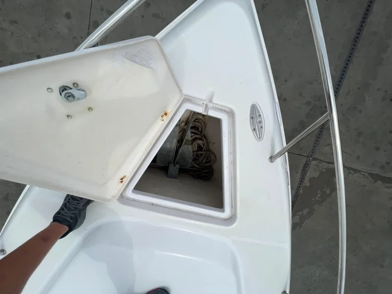 Slide: The Image of Open anchor compartment on 2002 Donzi 29 ZF Cuddy boat. - 42