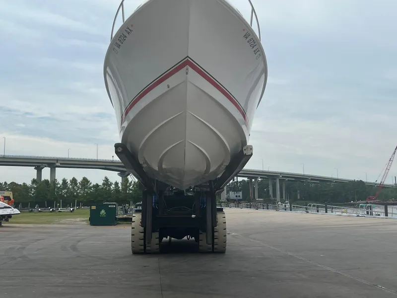 Slide: The Image of 2002 Donzi 29 ZF Cuddy boat on trailer, dockside view. - 7