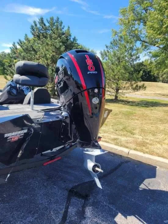 Slide: The Image of 2023 Tracker Pro Team 195 TXW Tournament Edition boat interior with seating and steering console. - 3