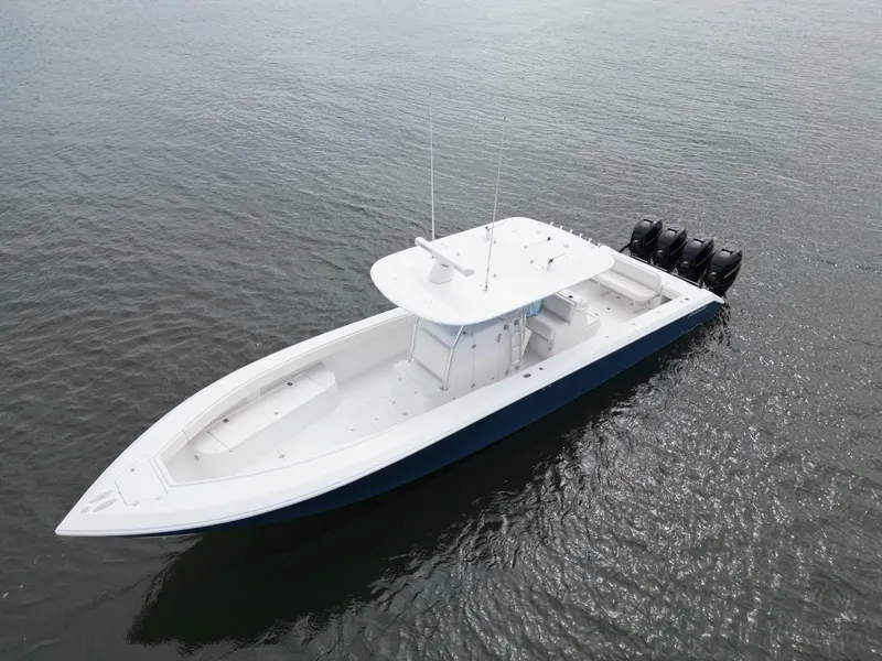 Slide: The Image of 2013 Bahama Open Fisherman boat with four outboard motors on water. - 10