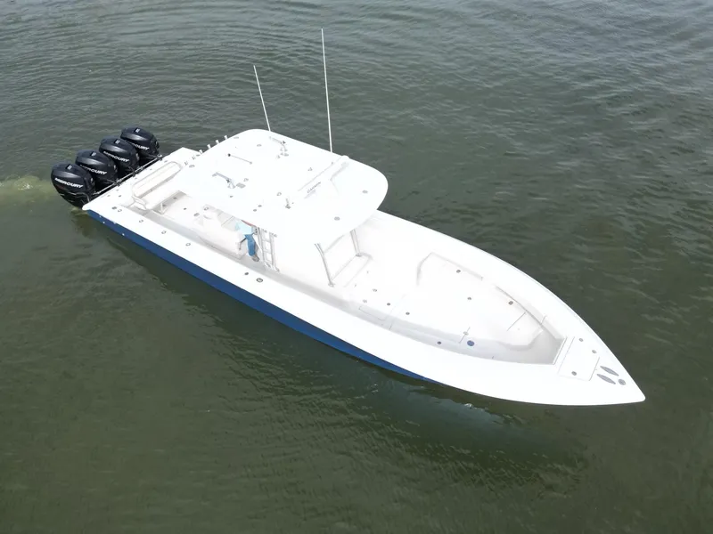 Slide: The Image of 2013 Bahama Open Fisherman boat with four Mercury outboard engines on water. - 11