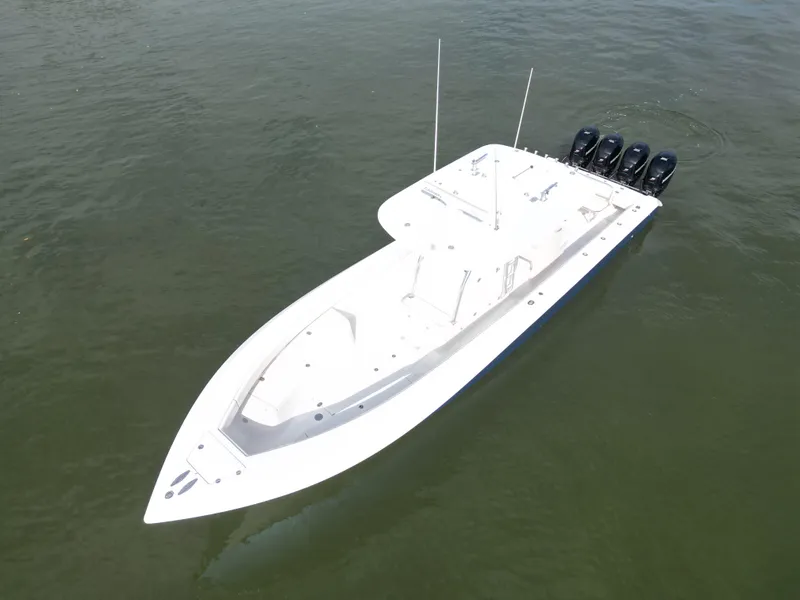 Slide: The Image of 2013 Bahama Open Fisherman boat with four outboard motors on water. - 12