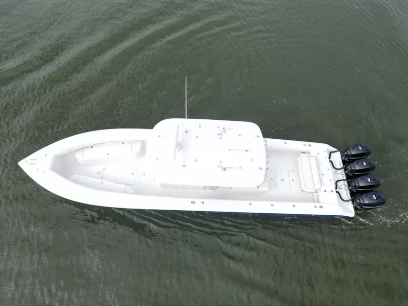 Slide: The Image of 2013 Bahama Open Fisherman boat with triple outboard engines on water. - 13