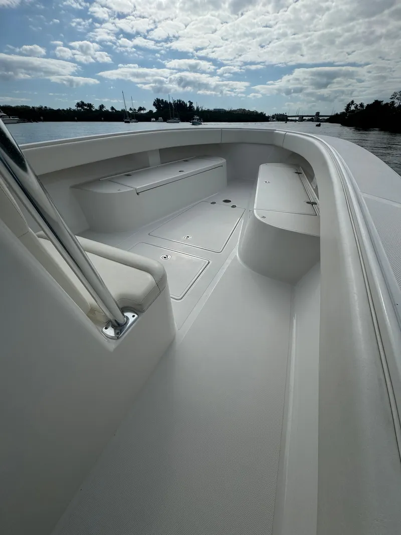 Slide: The Image of 2013 Bahama Open Fisherman boat interior with seating and storage compartments. - 15