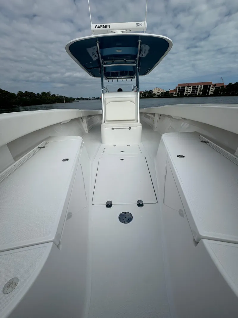 Slide: The Image of 2013 Bahama Open Fisherman boat with Garmin equipment on a calm waterway. - 16