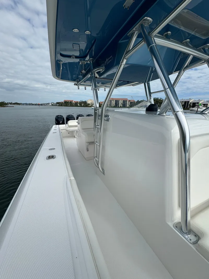 Slide: The Image of 2013 Bahama Open Fisherman boat with blue T-top and stainless steel frame. - 18