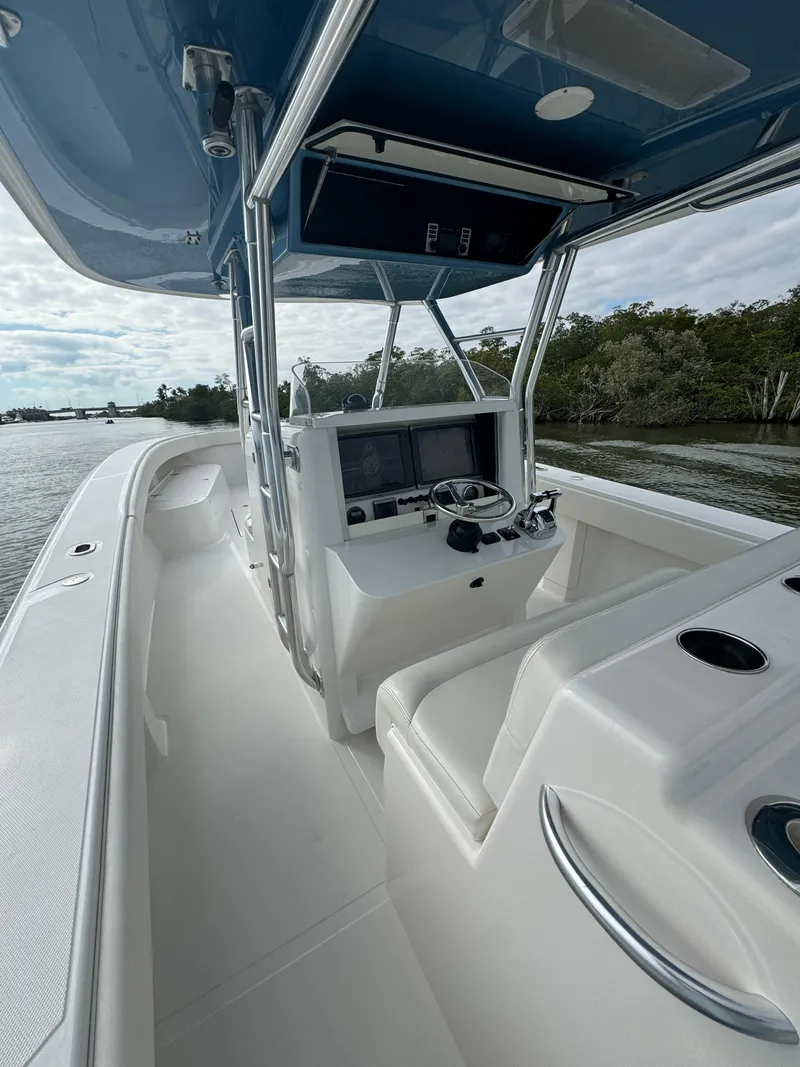 Slide: The Image of 2013 Bahama Open Fisherman boat interior with helm, seating, and water view. - 20