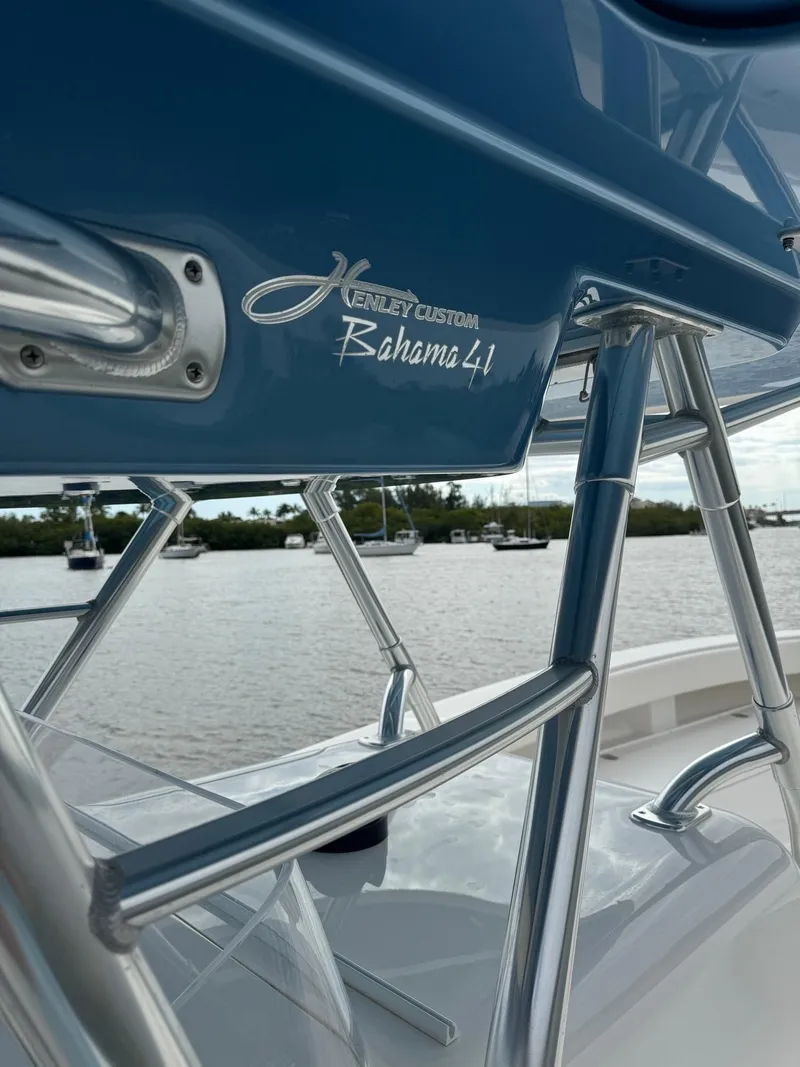 Slide: The Image of Close-up of 2013 Bahama Open Fisherman boat with Henley Custom Bahama 41 logo. - 23