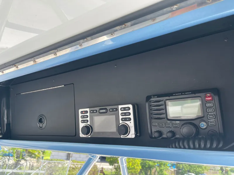 Slide: The Image of 2013 Bahama Open Fisherman boat dashboard with marine radio and control panel. - 24