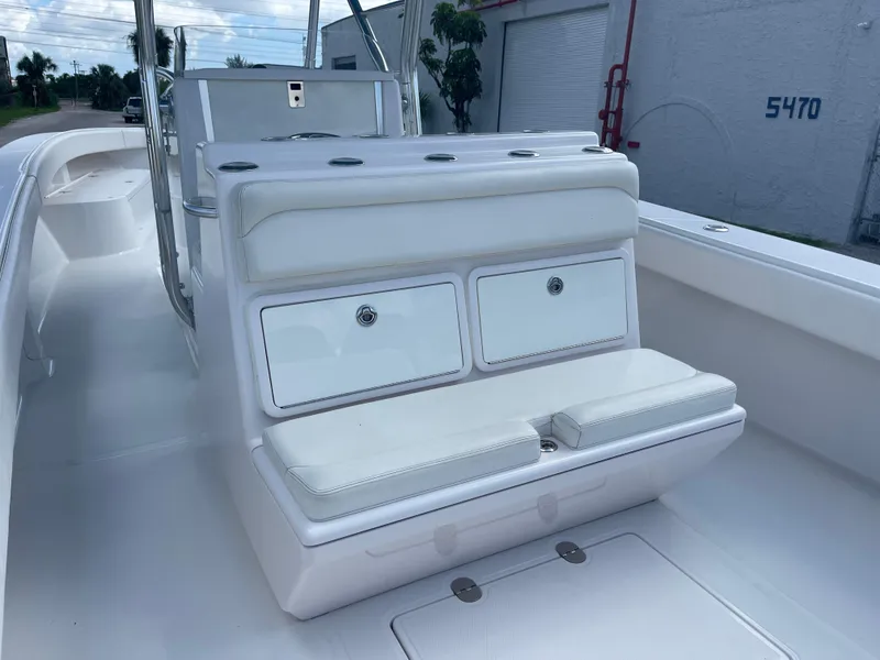 Slide: The Image of 2013 Bahama Open Fisherman boat interior with white seating and storage compartments. - 25