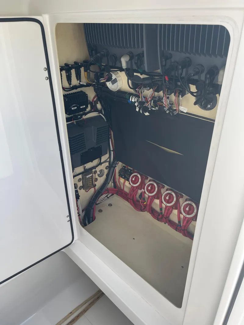 Slide: The Image of 2013 Bahama Open Fisherman electrical compartment with wiring and components. - 27