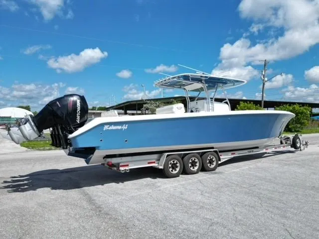 Slide: The Image of 2013 Bahama Open Fisherman boat on a trailer with triple Mercury outboard engines. - 29