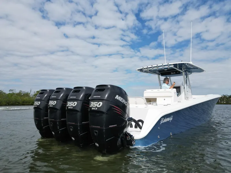 Slide: The Image of 2013 Bahama Open Fisherman boat with four Mercury 350 Verado engines on water. - 7