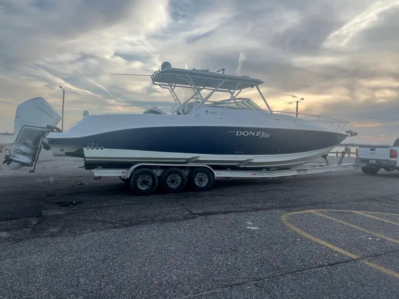 Slide: The Image of 2008 Donzi 38 ZSF boat on a trailer at sunset. - 10