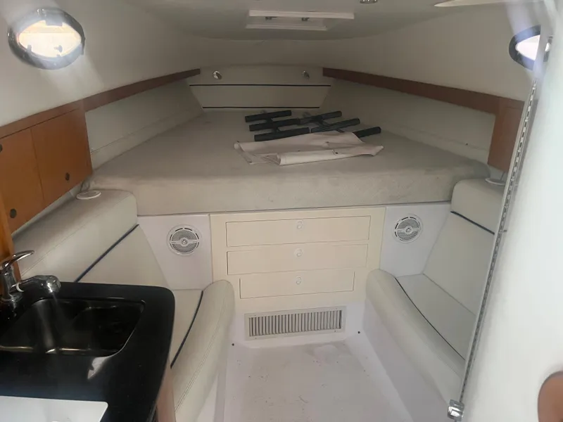 Slide: The Image of Interior cabin of a 2008 Donzi 38 ZSF boat with bed, sink, and storage. - 24