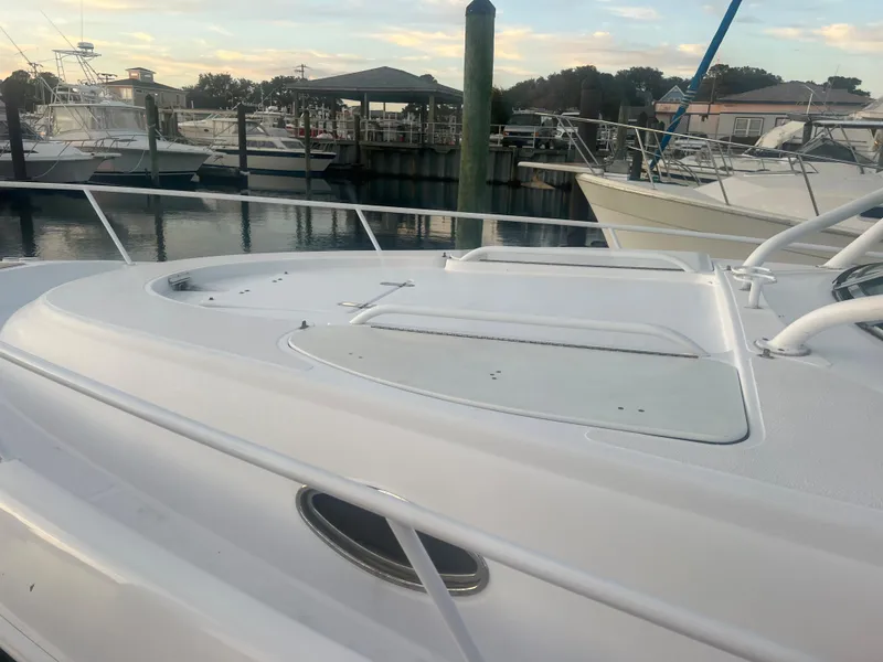 Slide: The Image of 2008 Donzi 38 ZSF boat docked at a marina. - 34