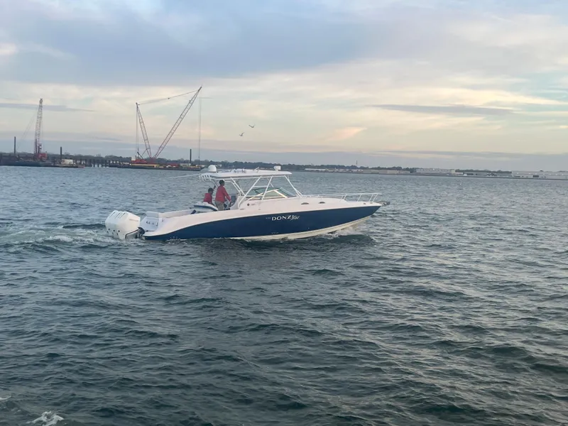 Slide: The Image of 2008 Donzi 38 ZSF boat cruising on open water. - 18